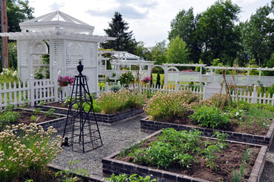 Center of vegetable gardem with sculptural sprinkler